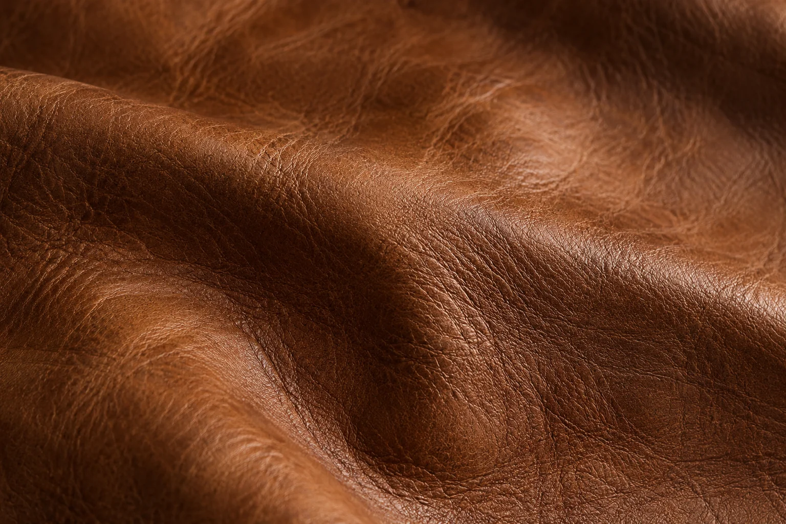 A close view of supple cognac leather and its natural grain.