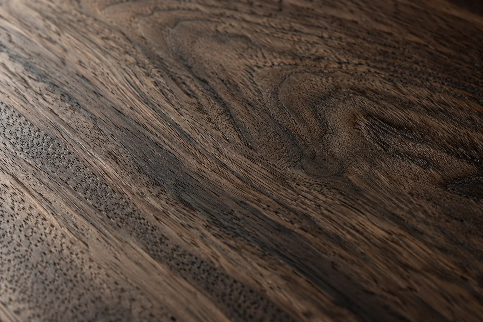 Dark timber with expressive natural grain.
