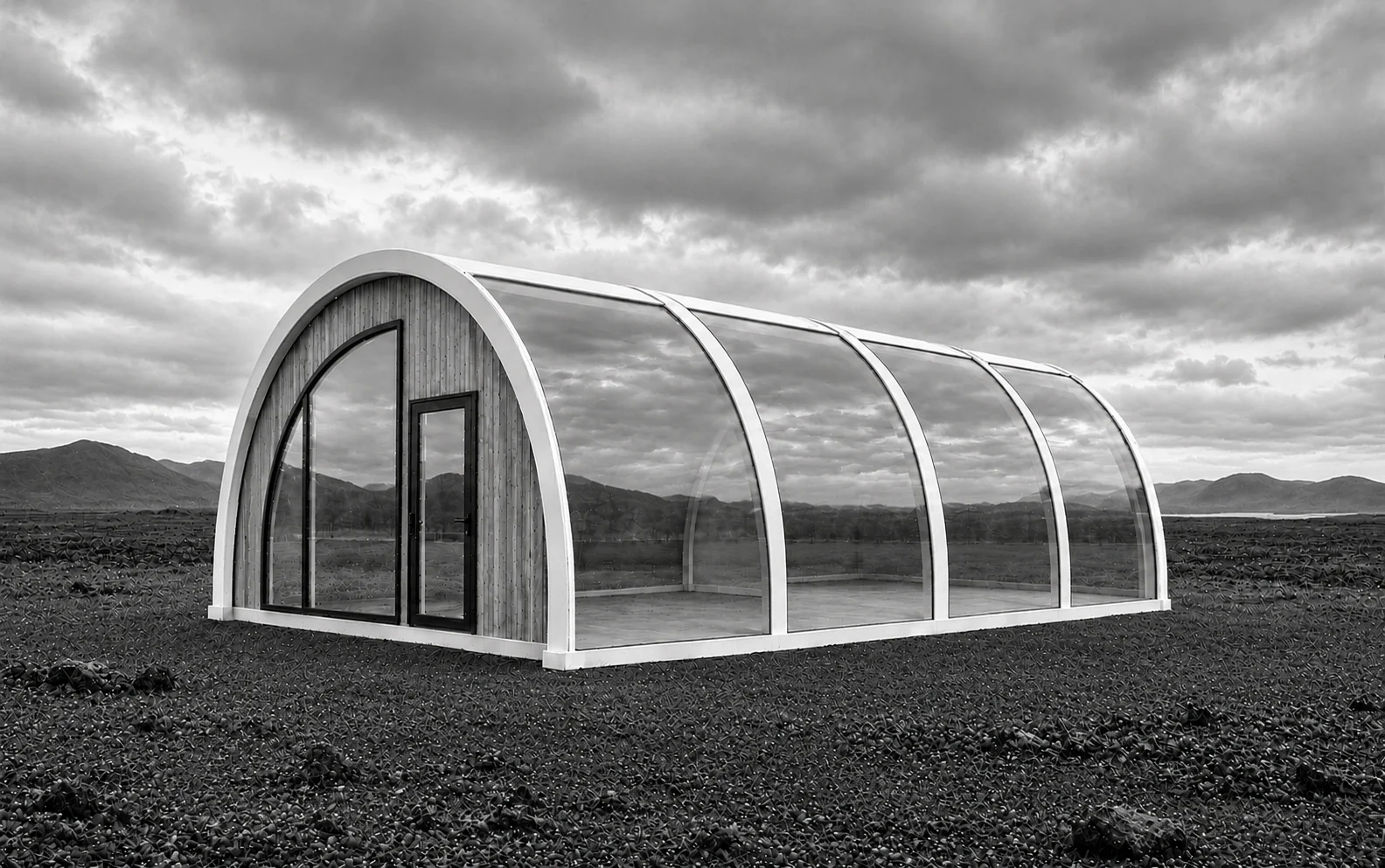 A tunnel-shaped MarsDome with an extended curved glass wall, opaque structural joints, a timber entrance wall and door.