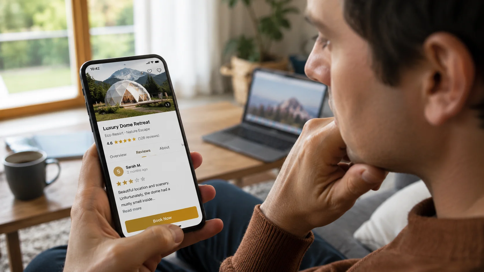 Guest inside a fabric dome, one hand pinching nose from musty smell, the other holding a phone with a 1-2 star review about to be submitted