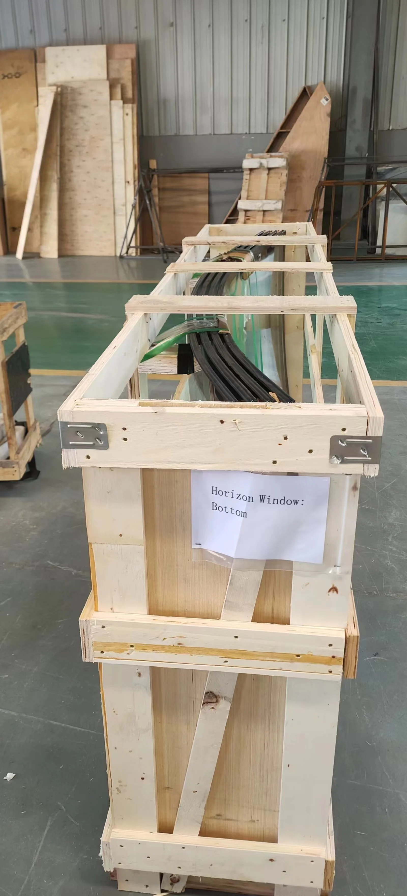 Horizon Windows packed in a wooden crate, labeled, showing the curved profile and double-glazed edge seal